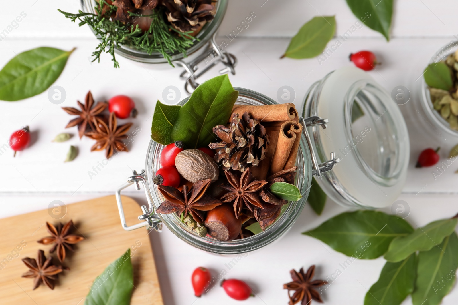 Photo of Aroma potpourri with different spices on white table, flat lay