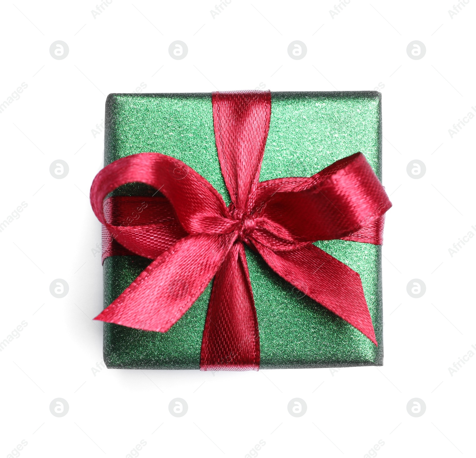 Photo of Christmas gift in box with red ribbon isolated on white, top view