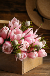 Photo of Beautiful bouquet of spring pink tulips on wooden table