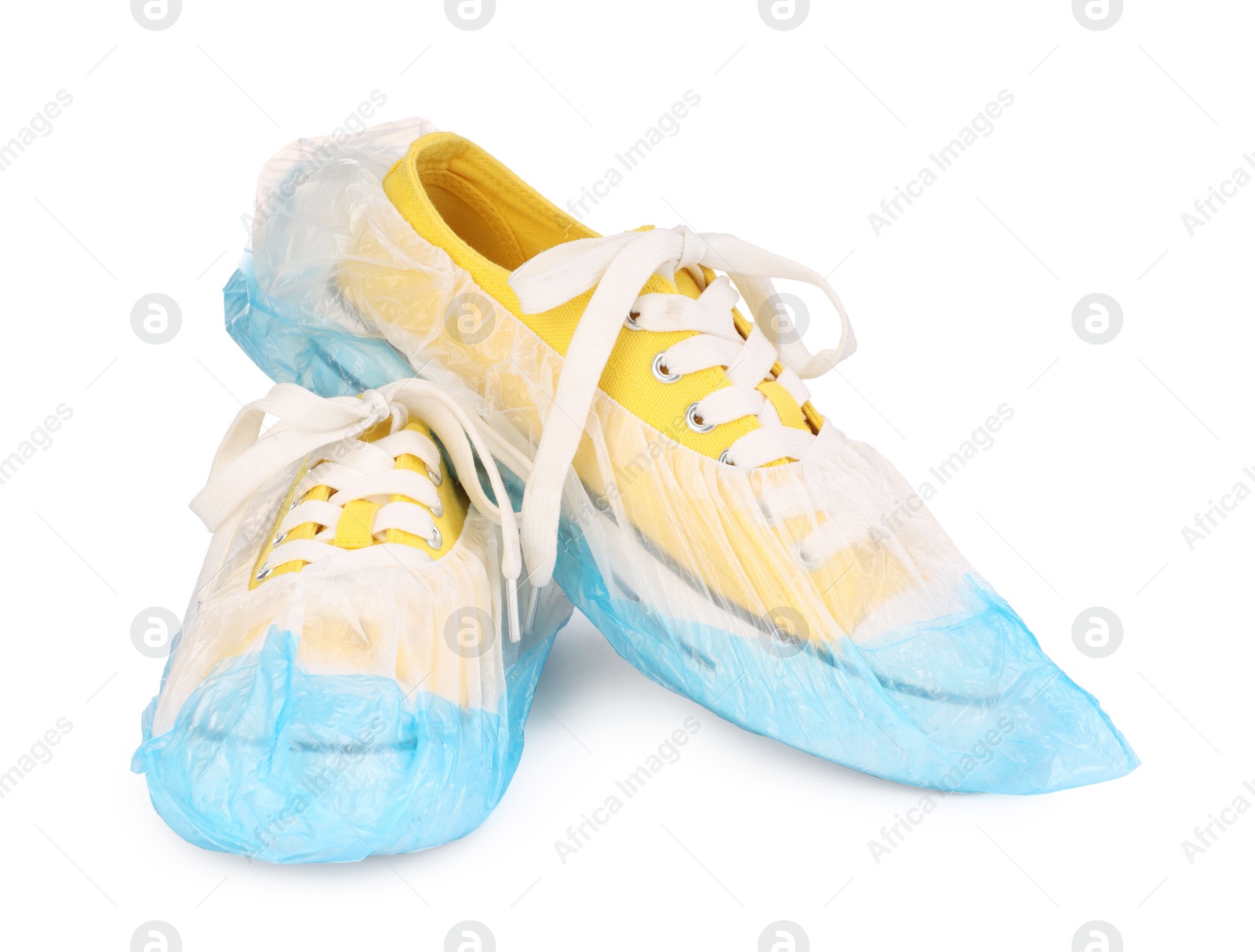 Photo of Sneakers in blue shoe covers isolated on white