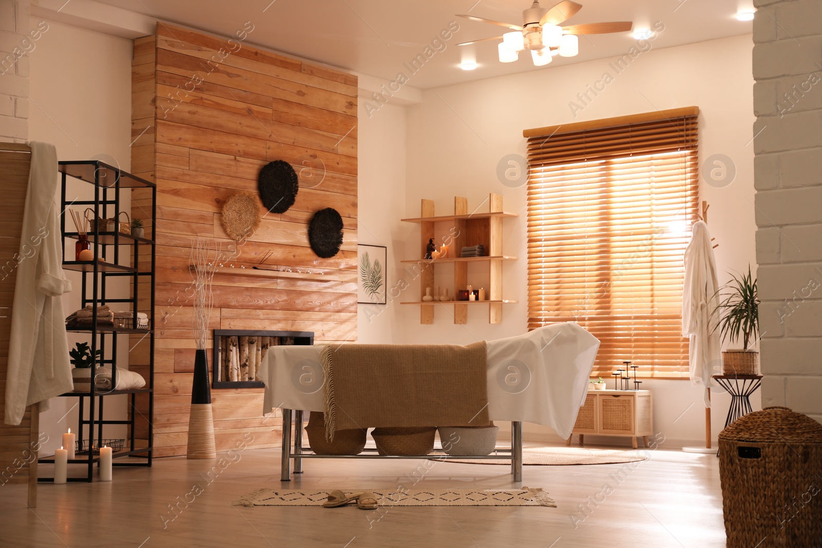 Photo of Stylish massage room interior in spa salon