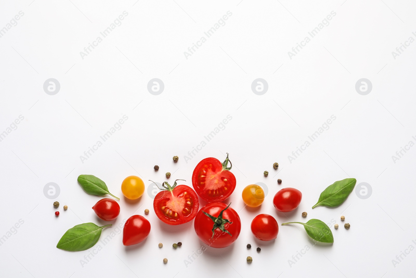 Photo of Composition with ripe cherry tomatoes and basil leaves on white background, top view