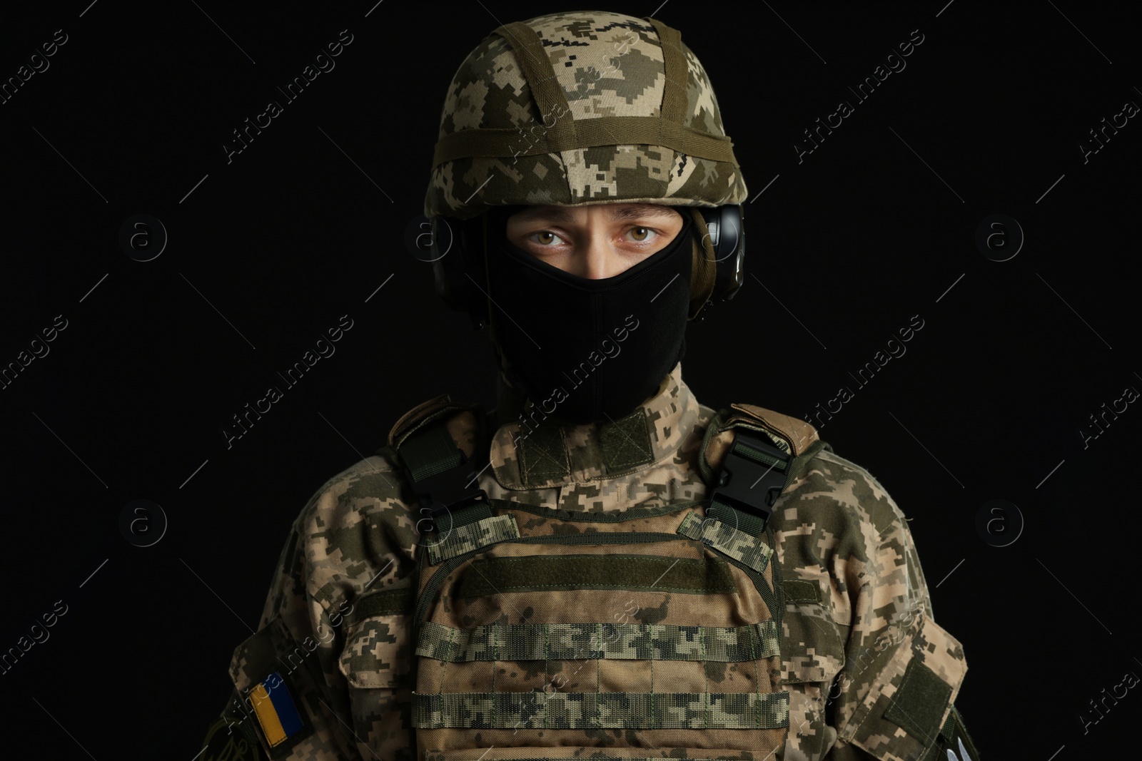 Photo of Soldier in Ukrainian military uniform on black background