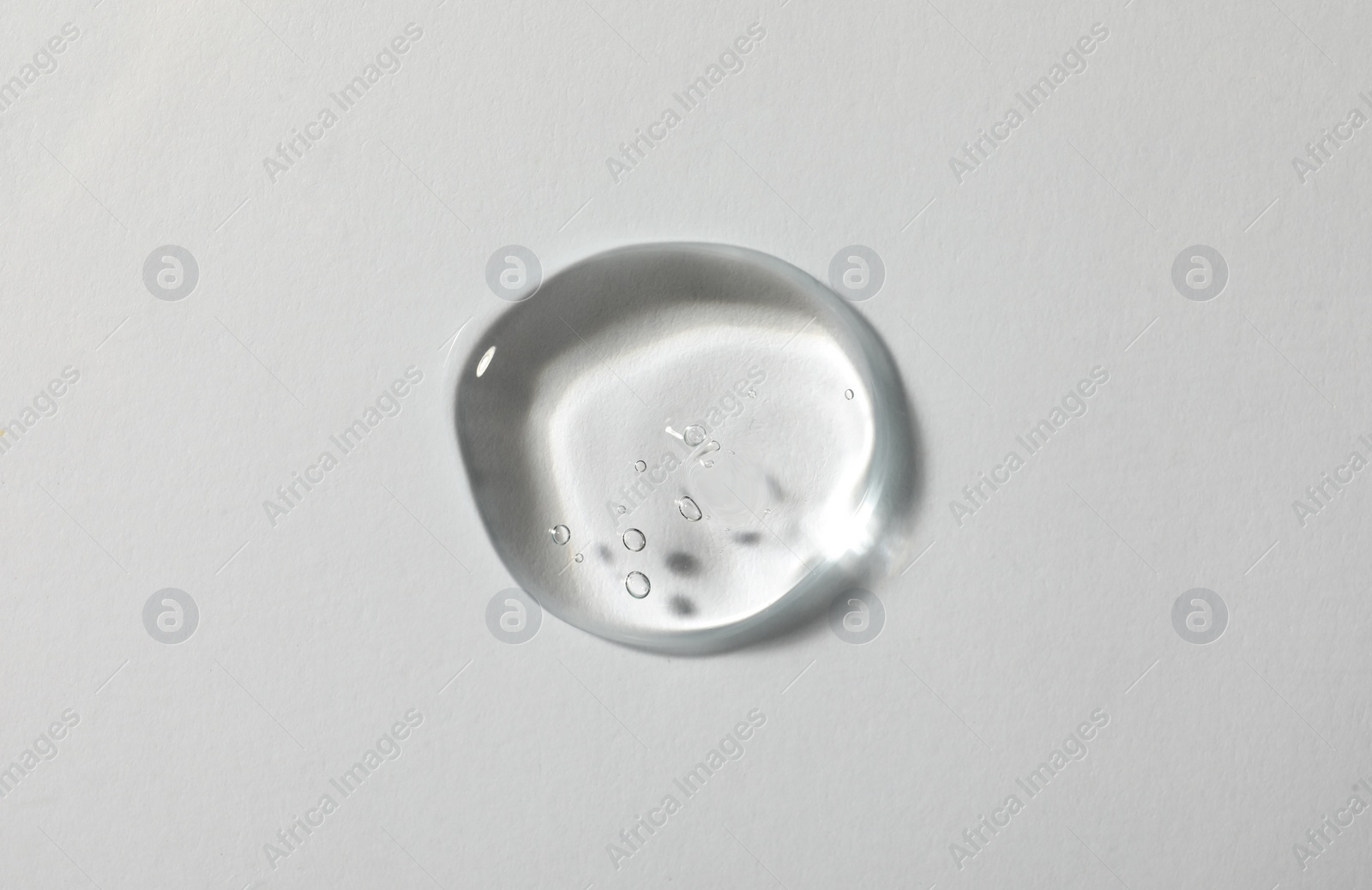 Photo of Sample of cosmetic gel on white background, top view