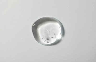 Photo of Sample of cosmetic gel on white background, top view