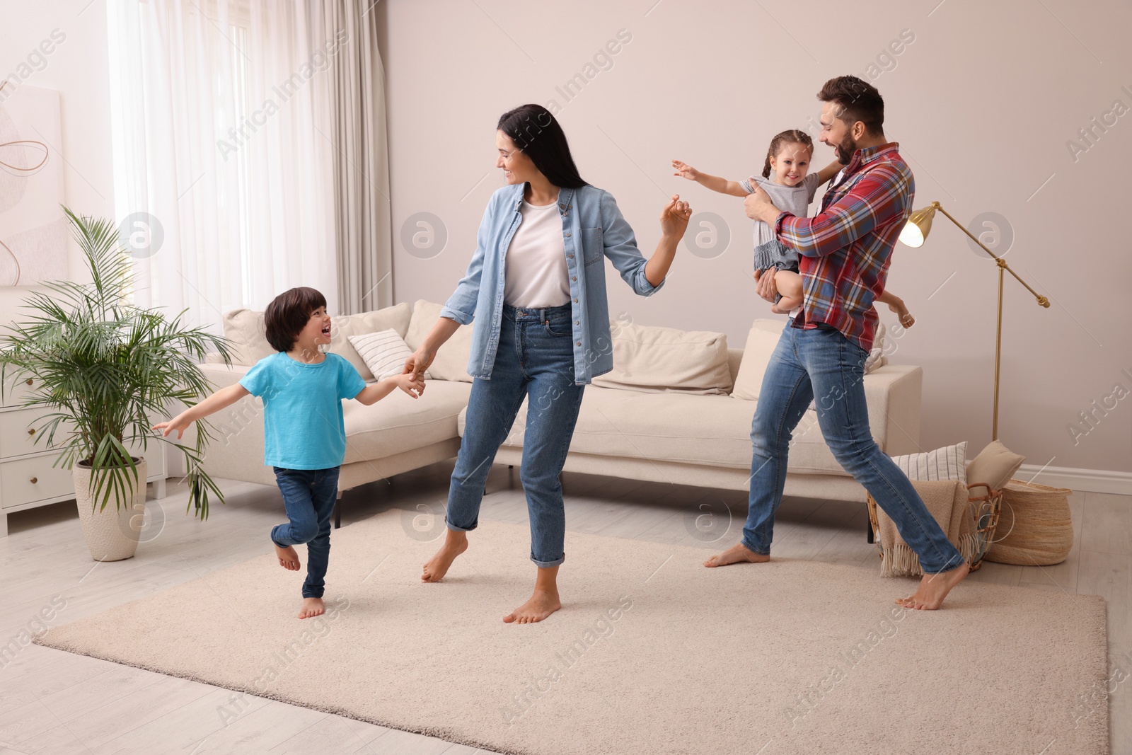 Photo of Happy family spending time together at home