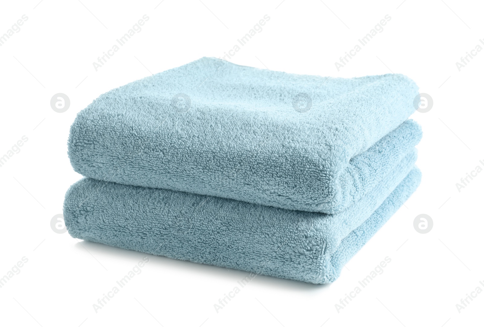 Photo of Folded clean soft towels on white background