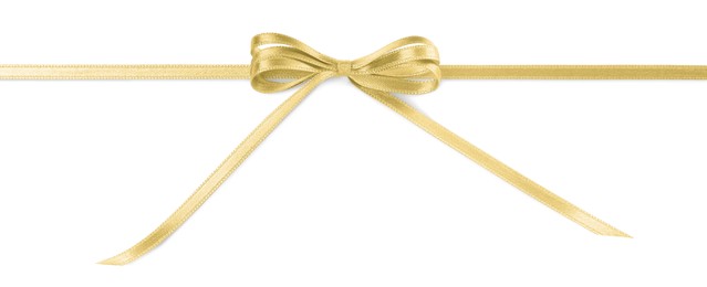 Golden satin ribbon with bow on white background, top view