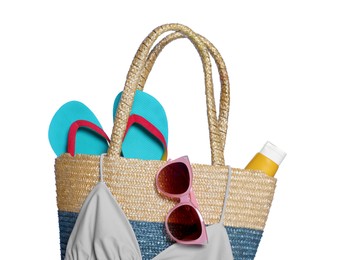 Photo of Stylish bag with sunglasses and other beach accessories isolated on white