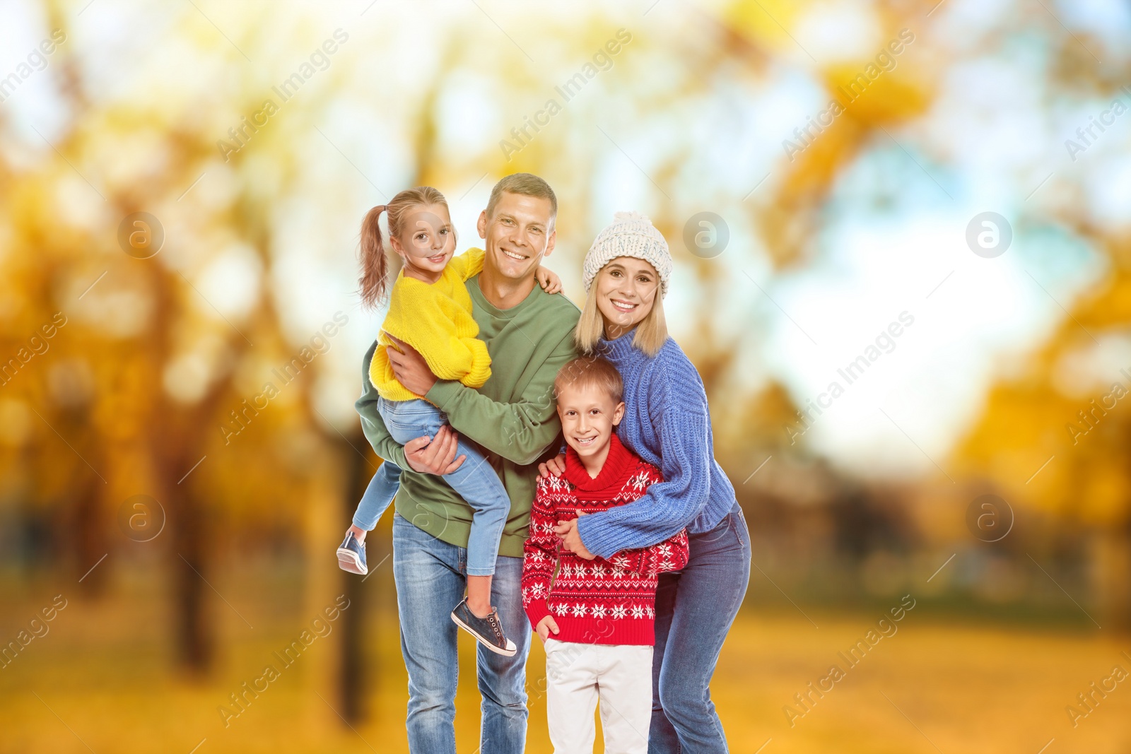 Image of Happy family spending time together at autumn park 