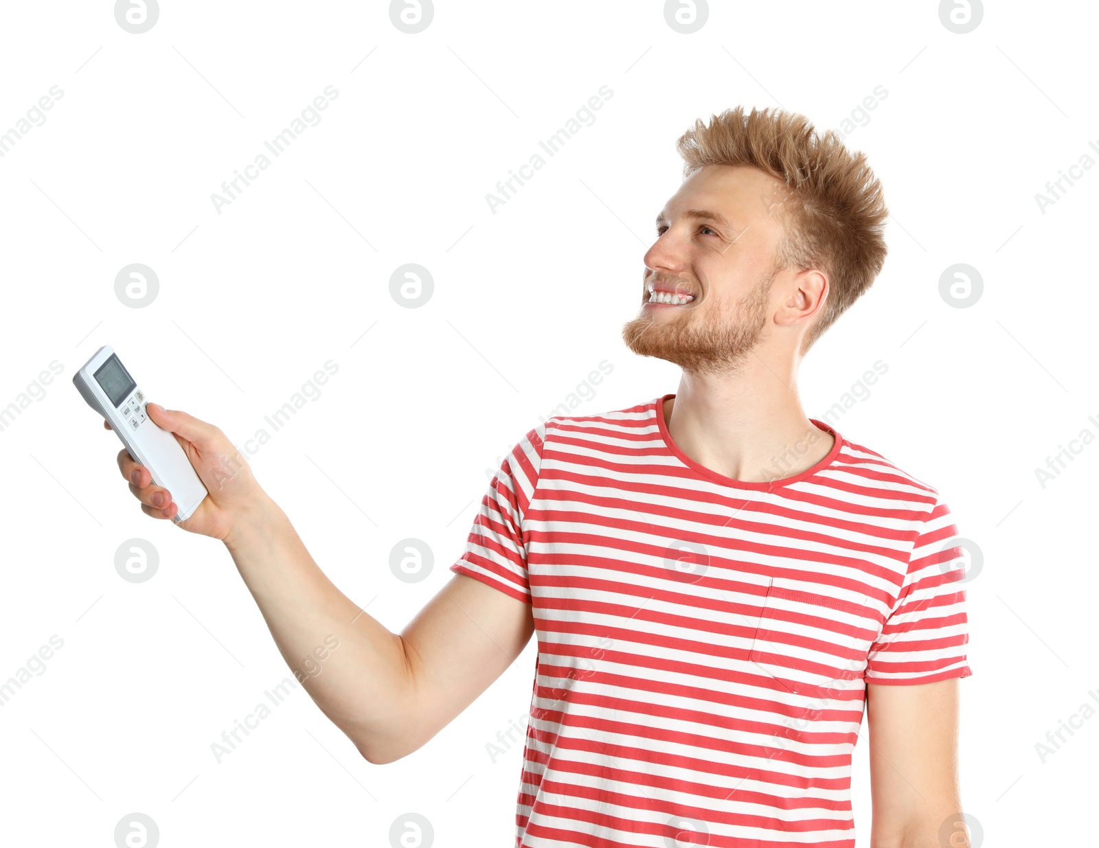 Photo of Young man with air conditioner remote on white background