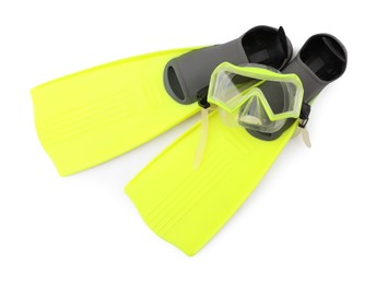 Pair of yellow flippers and diving mask isolated on white, top view. Sports equipment