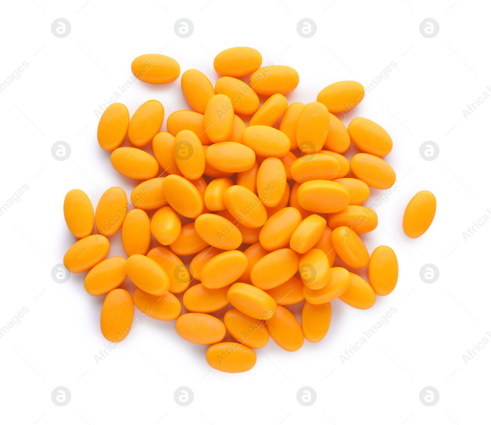 Photo of Tasty orange dragee candies on white background, top view