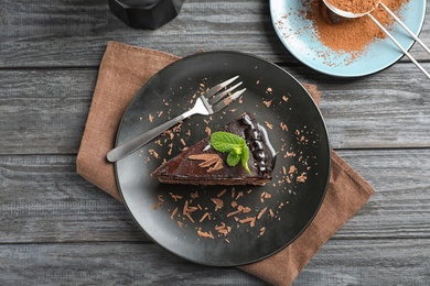 Flat lay composition with tasty chocolate cake on table