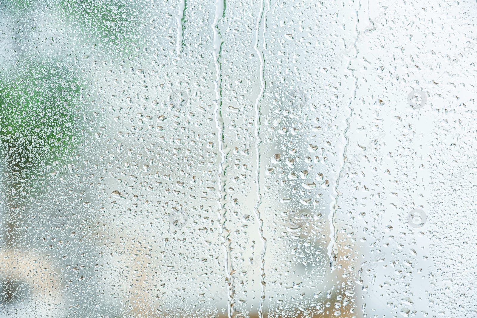 Photo of View of glass with water drops, closeup