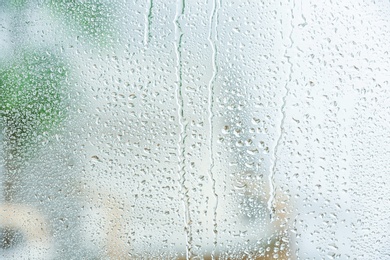 Photo of View of glass with water drops, closeup