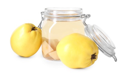 Delicious quince drink in glass jar and fresh fruits isolated on white