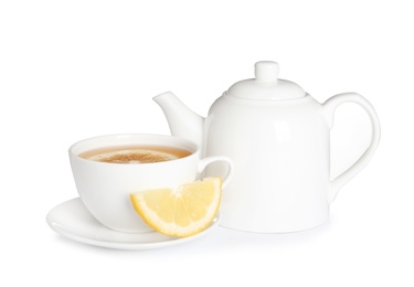 Photo of Teapot and cup of tea with lemon on white background