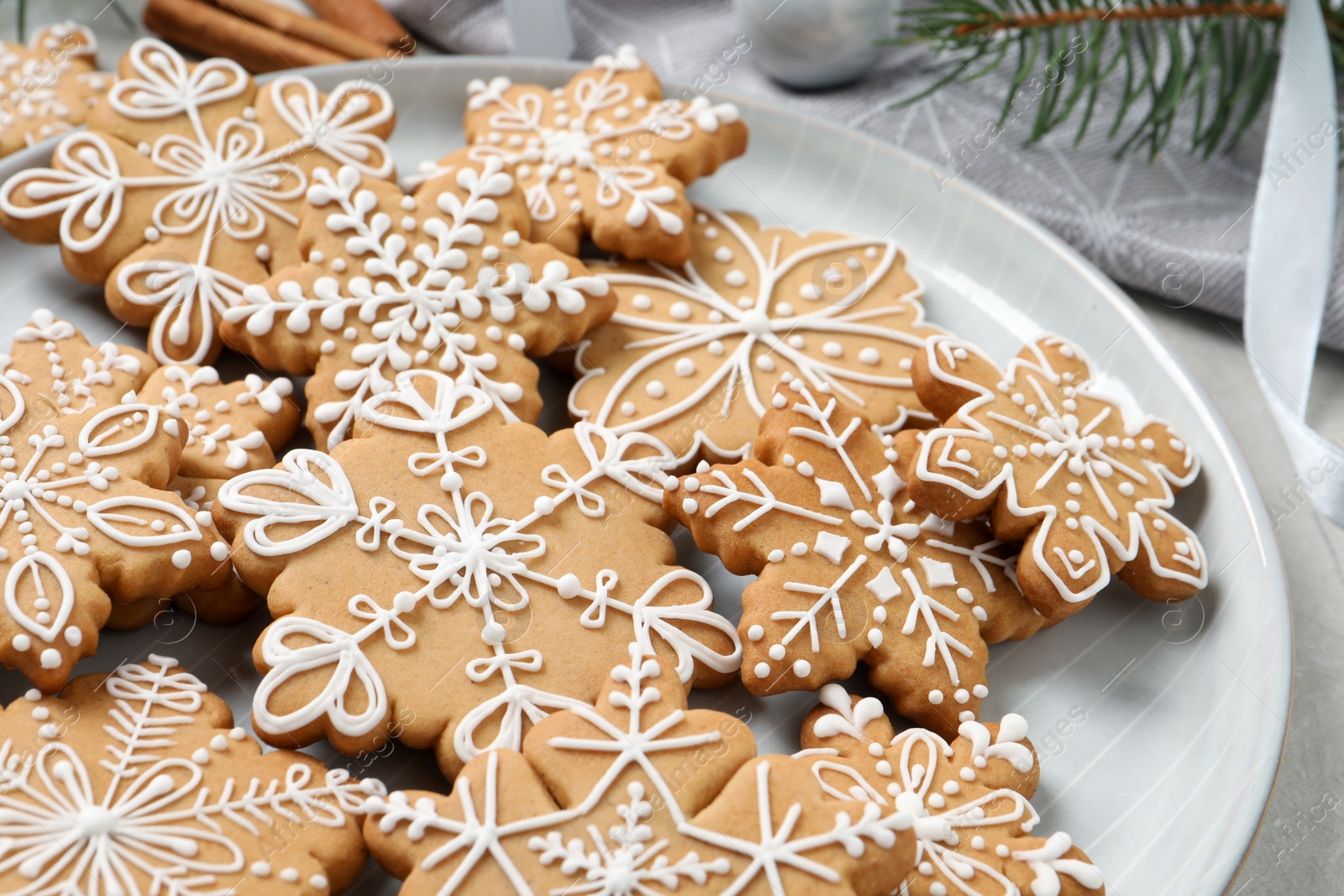 Photo of Tasty Christmas cookies on light table, closeup