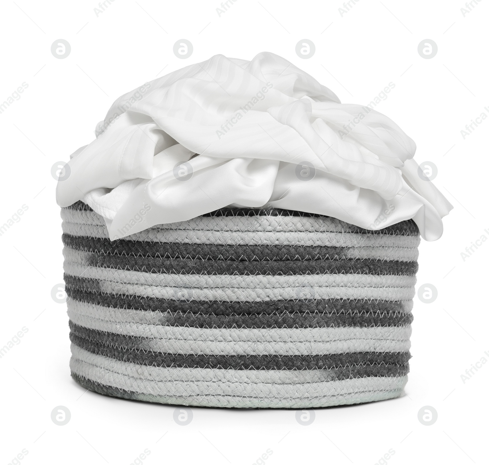 Photo of Laundry basket with clean clothes isolated on white