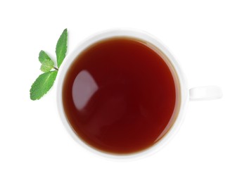 Cup of aromatic black tea with fresh mint on white background, top view