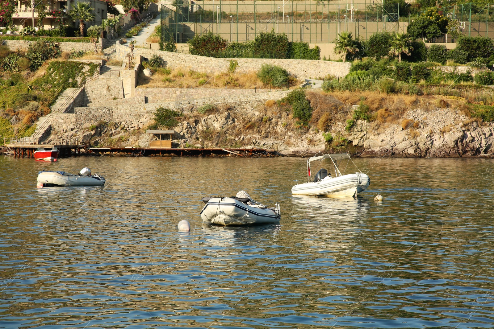 Photo of Inflatable boats on sea near coastal city