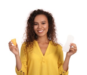 Photo of Young African American woman with menstrual cup and pantyliner on white background