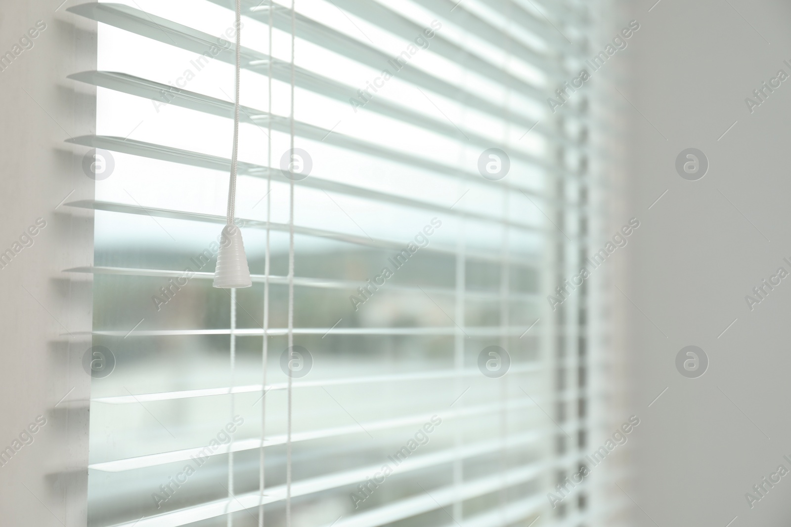 Photo of Closeup view of stylish horizontal window blinds