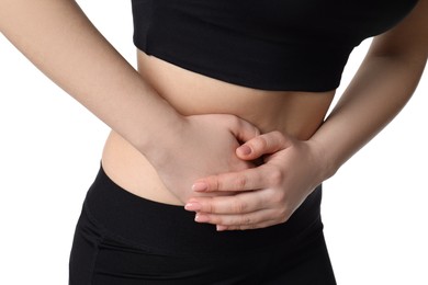 Photo of Woman suffering from pain in lower right abdomen on white background, closeup. Acute appendicitis