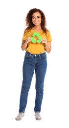 Photo of Young African-American woman with recycling symbol on white background