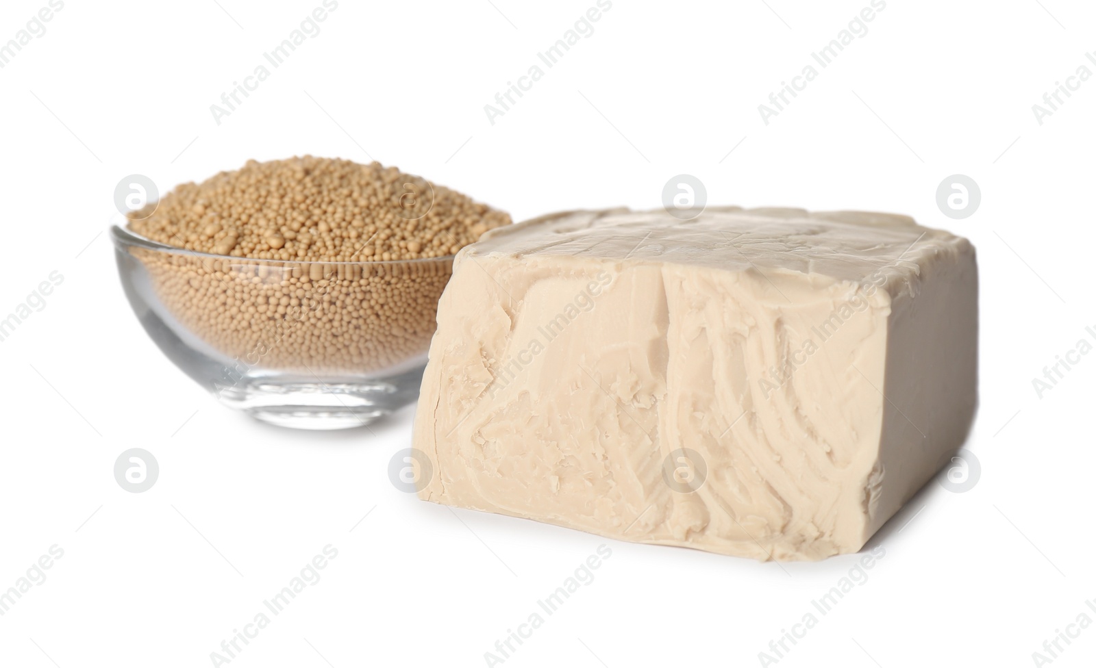 Photo of Compressed and granulated yeast on white background