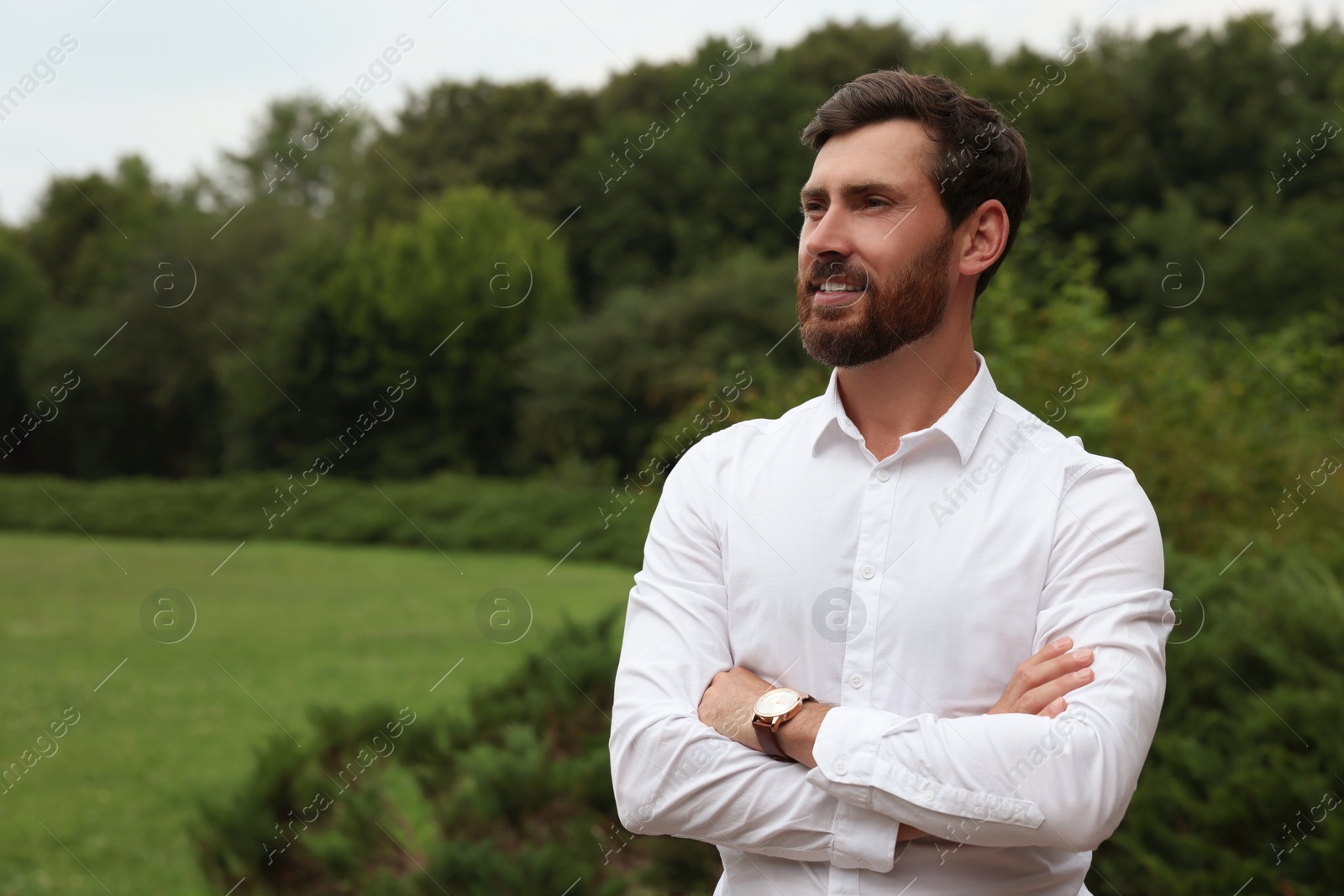 Photo of Portrait of handsome bearded man in park, space for text