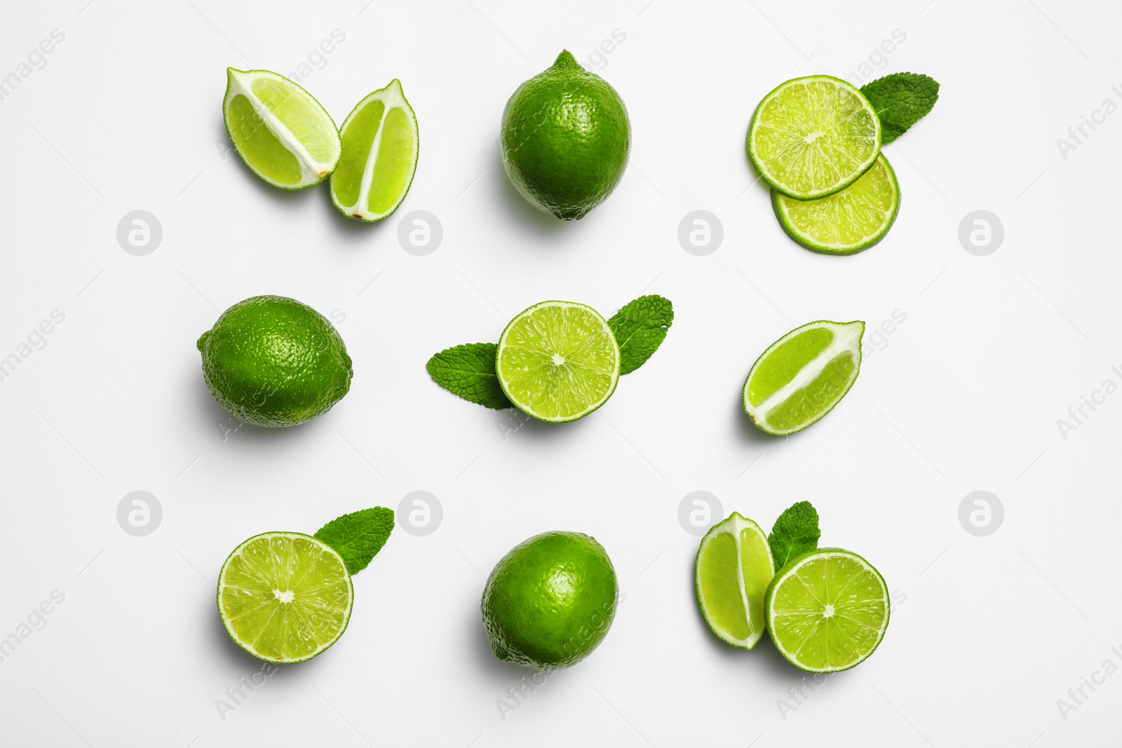 Photo of Flat lay composition with fresh juicy limes and mint on white background