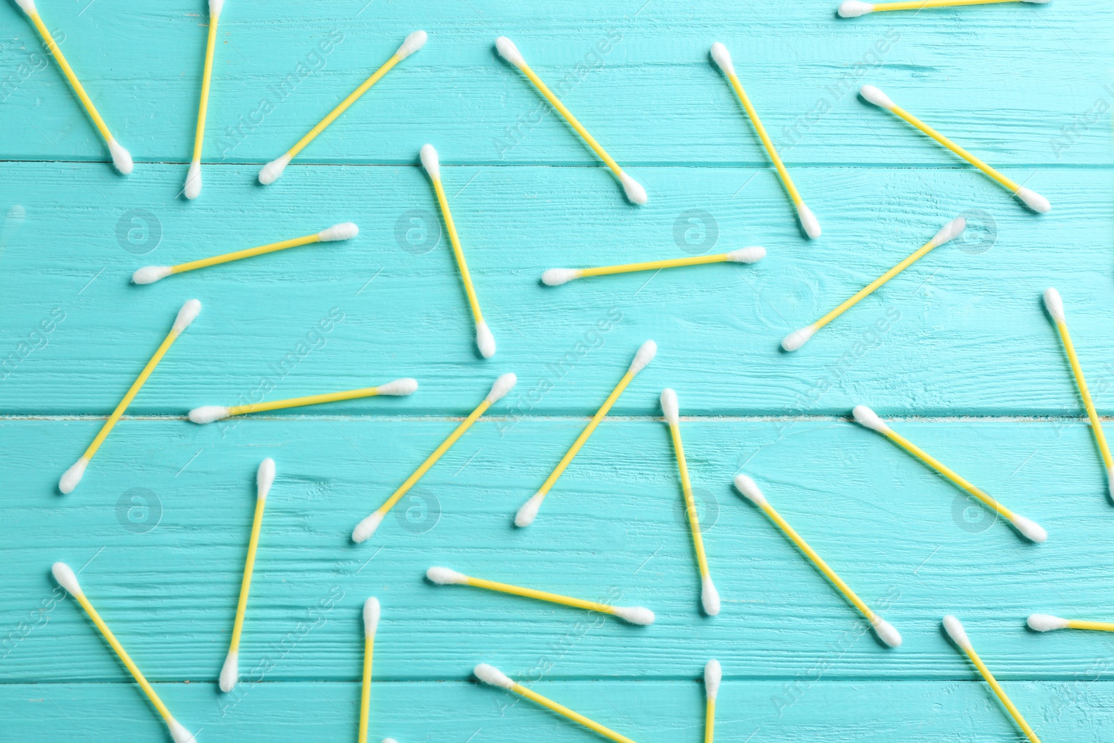 Photo of Flat lay composition with cotton swabs on wooden background