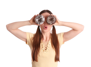 Beautiful young woman with donuts on white background