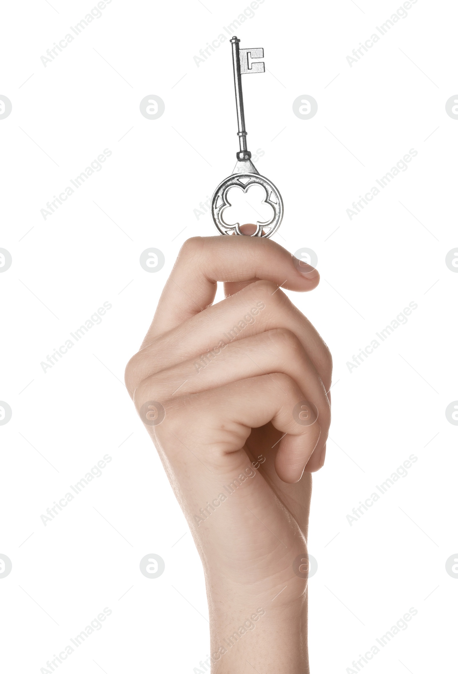 Photo of Woman holding silver vintage ornate key on white background, closeup