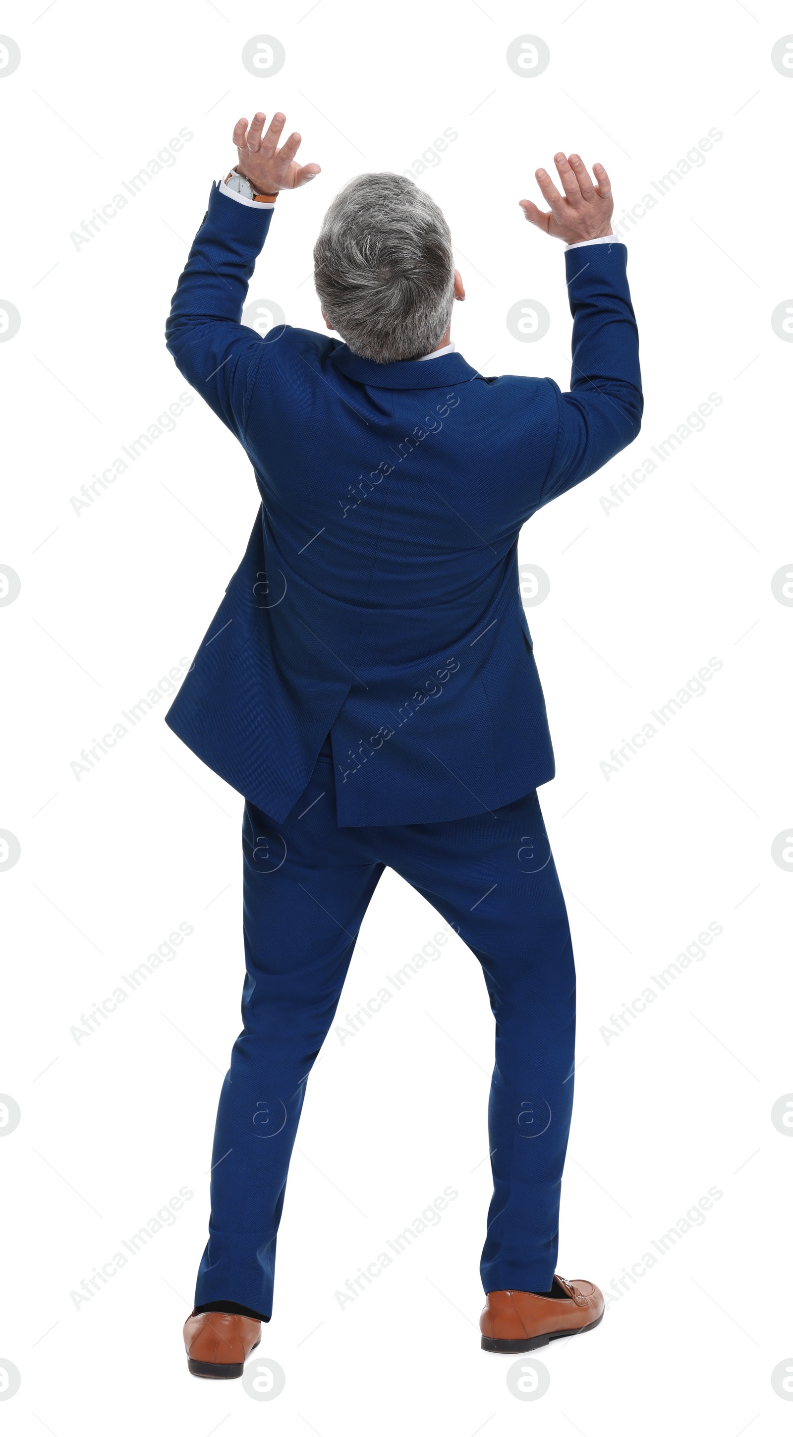 Photo of Mature businessman in stylish clothes avoiding something on white background, back view