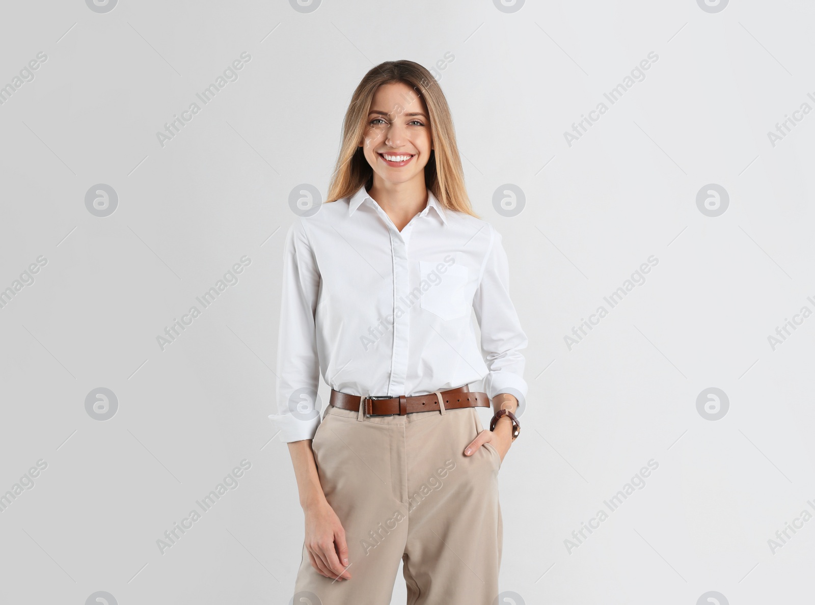 Photo of Portrait of beautiful young businesswoman on white background