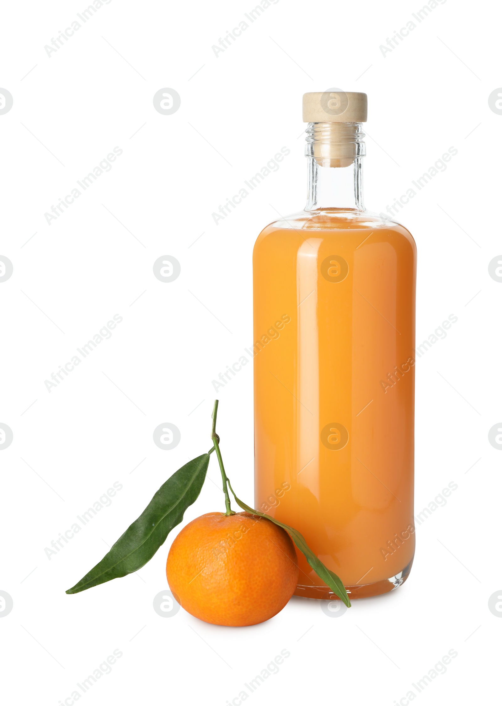 Photo of Bottle of tasty tangerine liqueur and fresh fruit isolated on white