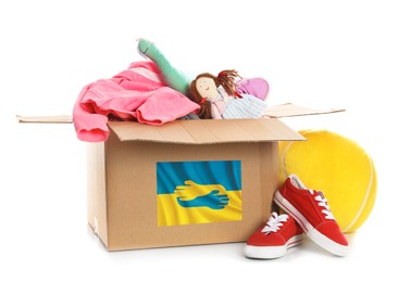Humanitarian aid for Ukrainian refugees. Donation box, shoes, clothes and toys on white background