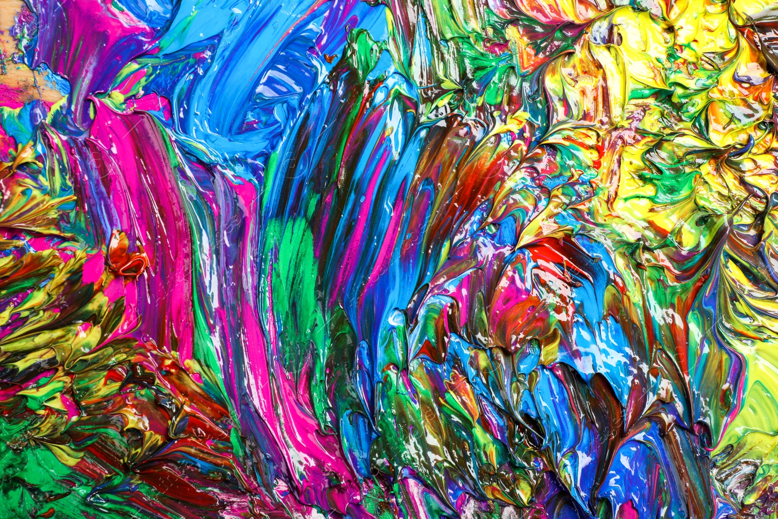 Photo of Abstract colorful acrylic paint as background, top view