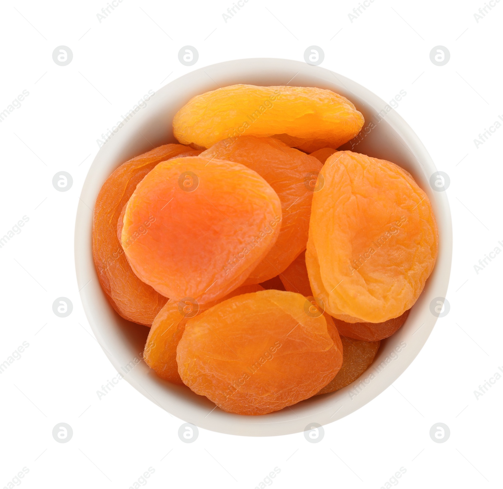 Photo of Bowl with apricots on white background, top view. Dried fruit as healthy food