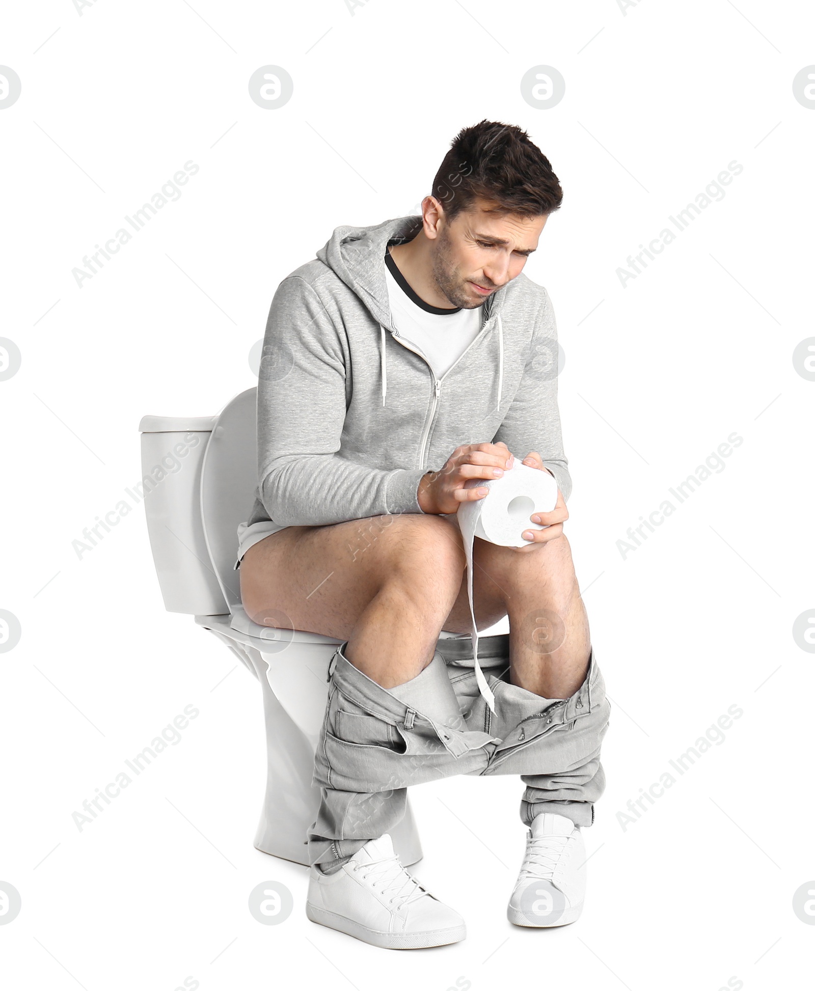 Photo of Man suffering from diarrhea on toilet bowl, white background