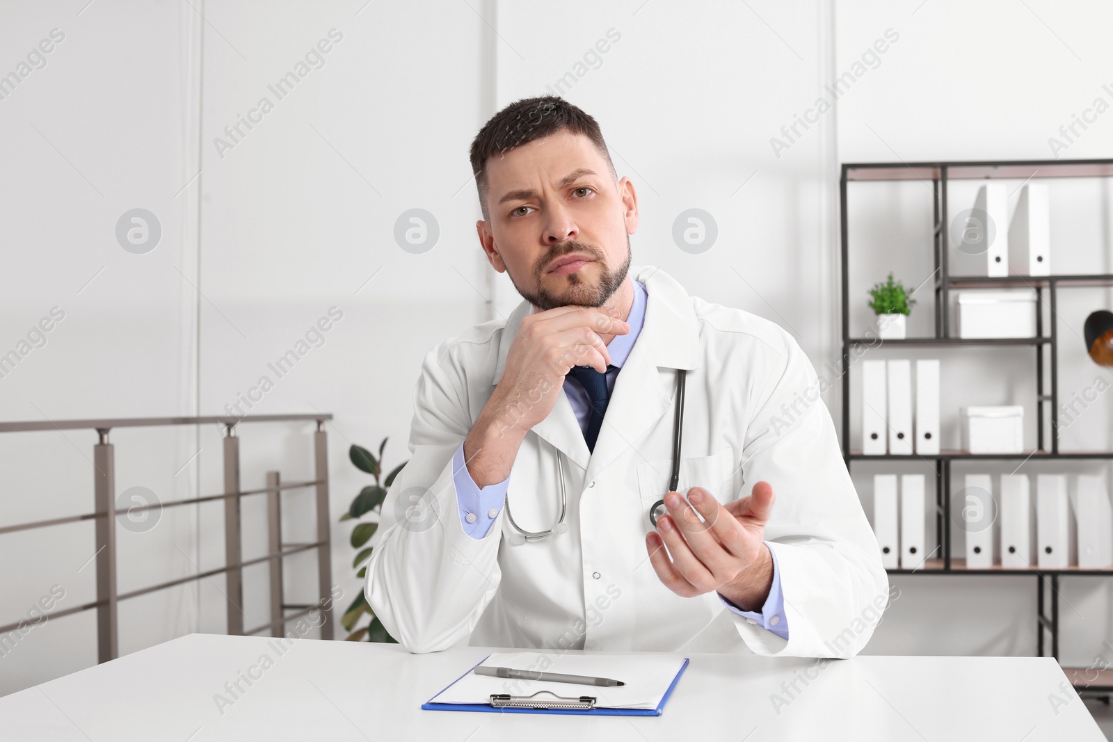 Photo of Pediatrician consulting patient using video chat in clinic, view from webcam