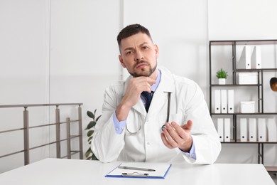 Pediatrician consulting patient using video chat in clinic, view from webcam