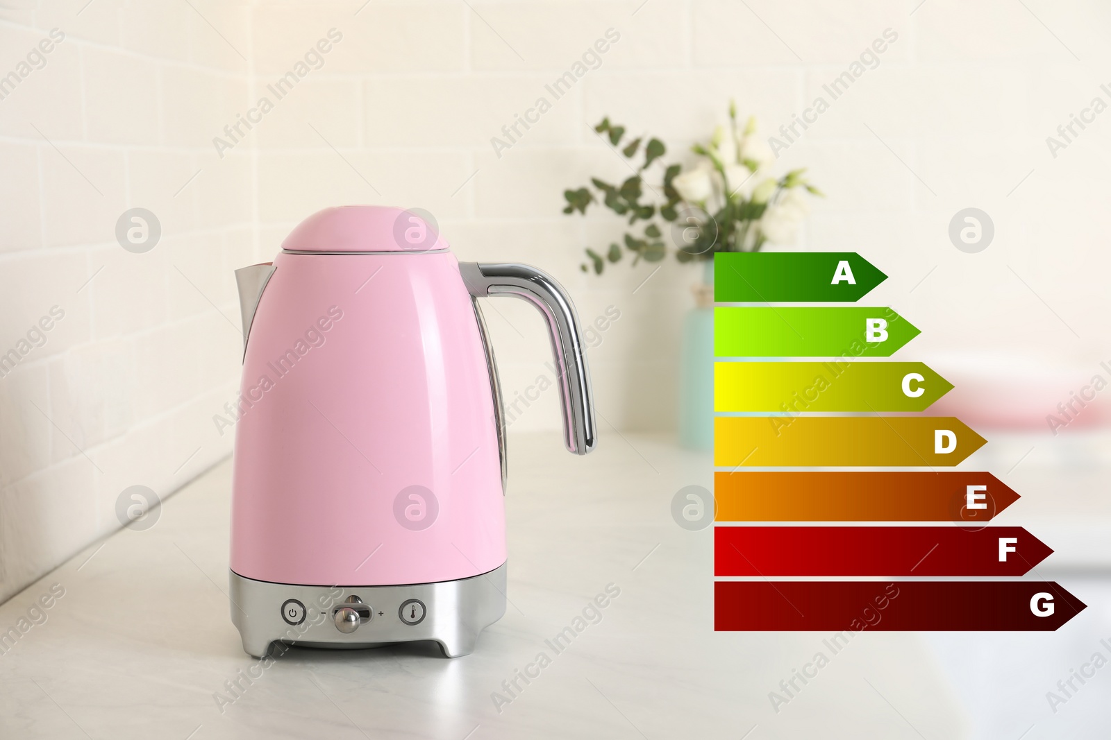 Image of Energy efficiency rating label and electric kettle indoors