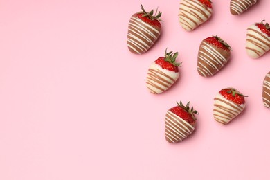 Photo of Delicious chocolate covered strawberries on pink background, flat lay. Space for text