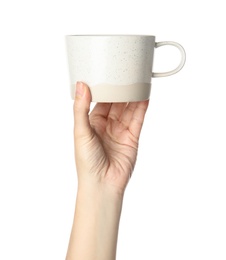 Woman holding ceramic cup on white background, closeup