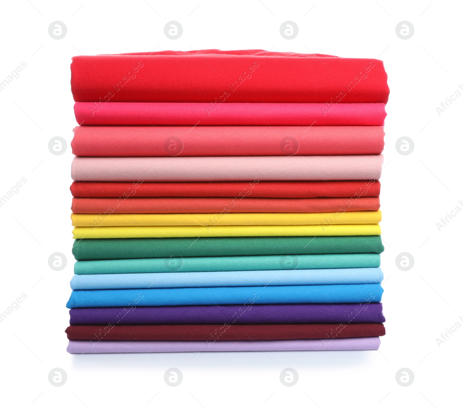 Photo of Pile of colorful t-shirts on white background