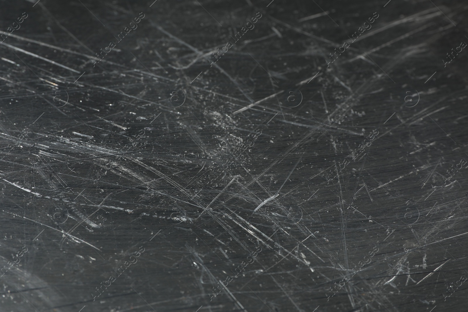 Photo of Texture of scratched metallic surface as background, closeup